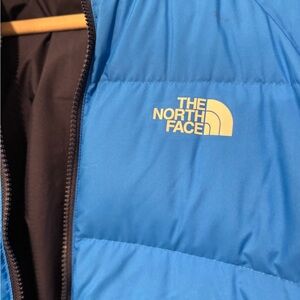 Boys XL reversible North Face puffy coat.